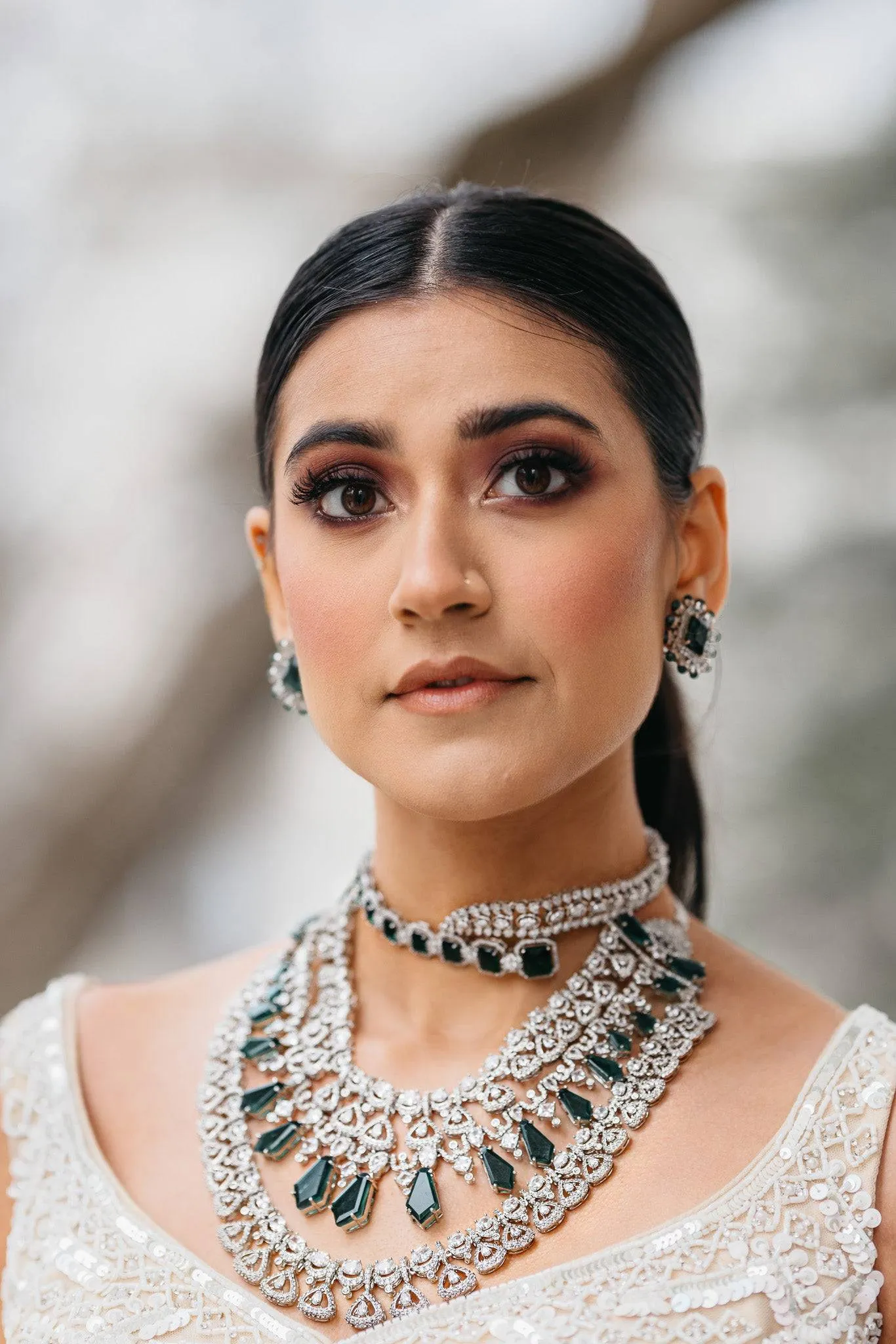 Ashma - Multilayer Rhodium Plated Silver Finish & Emerald Green Bridal Set