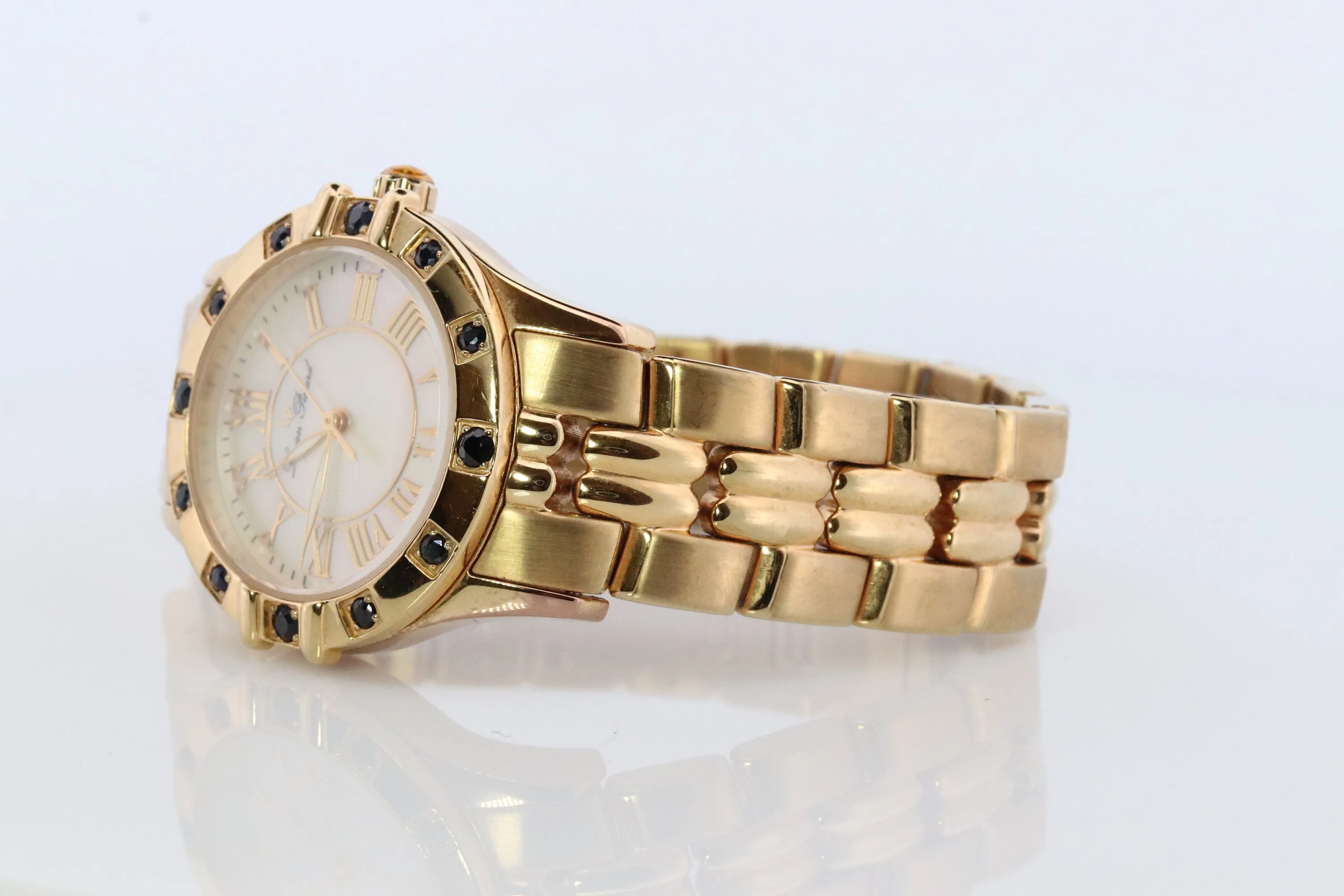 Lucien Piccard  watch Ladies. Stainless Steel Gold Tone with Sapphires and MOP Face. Women's Lucien Piccard watch.
